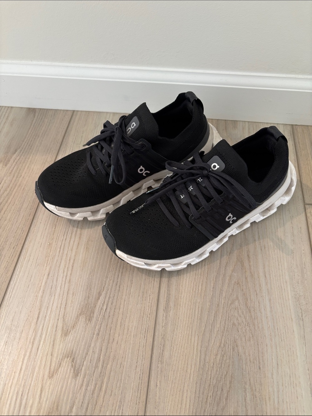 On Running Black and White Cloudswift Sneakers.